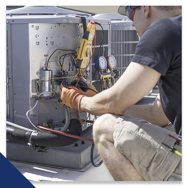 HVAC service professional performing maintenance on a Carrier unit in Billings, MT